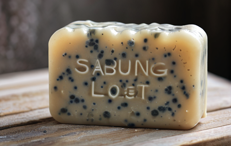 **
Close-up shot of a natural soap bar with white spots and a slightly slimy texture. Focus on the details that indicate spoilage. The background should be a blurry, humid bathroom setting. "Sabun natural dah tak elok! Rugi beli..." text overlay in a handwritten style. (Style: realistic, slightly desaturated colors)
**